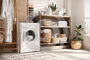 Washing machine and shelving unit in laundry room interior