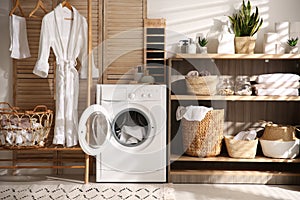 Washing machine and shelving unit in laundry room interior