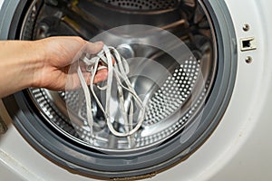 Washing in a washing machine white shoelaces from sneakers