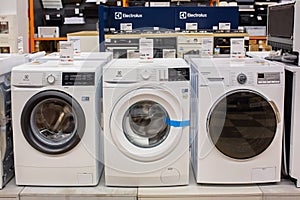 Washing machines displayed in the showroom of a commercial store. Minsk, Belarus - February, 2022