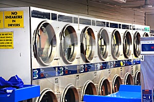 Washing machines inside laundry shop or launderette