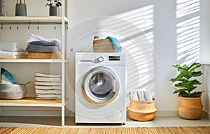 Washing machines in laundry room interior with wardrobe and accessories