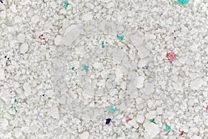 Washing powder under microscope - image width 23mm, colourful granules are optical brighteners