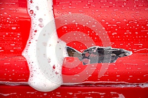 washing red car outdoor