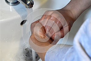 Washing and rinsing hands. Protection against coronavirus,  virus, flu and bacteria