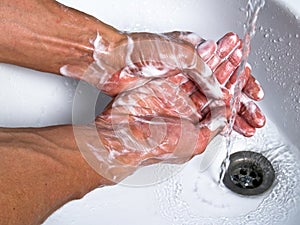 Washing soapy hands