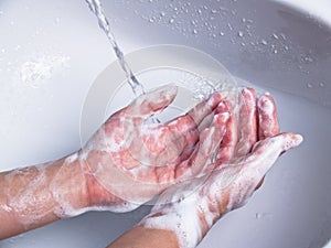 Washing soapy hands