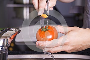 Washing a tomato