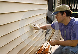 Washing Vinyl Siding of House