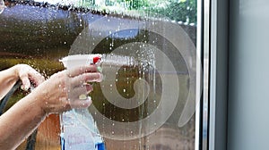 Washing the window by a person from the street