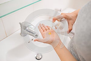 Washing, women`s hand with soap under the crane with water