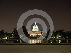 Washington DC, District of Columbia [United States US Capitol Building, night view with lights over reflecting pond,