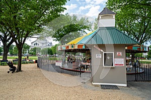Washington DC - May 9, 2019: The historic Carousel on the Mall spins around on a spring day on the National Mall. Ticket booth in