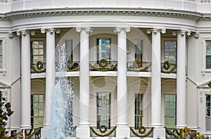 Washington DC, USA. White House detail with fountain and columns background.