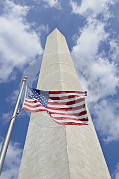 Washington Monument with American flag in front