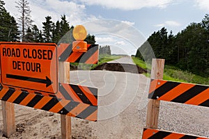 Washout: rain flood damaged badly washed out road photo