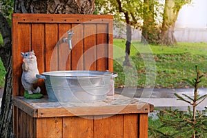 Washstand in village in outside. Washing hands in rustic garden in sunny day