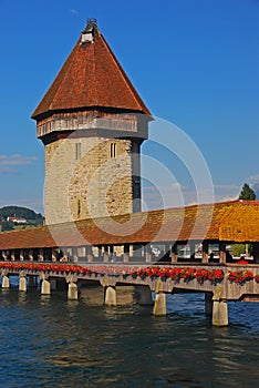 Wasserturm, water tower of Kapellbrucke, Chapel Bridge is a covered wooden footbridge over river Reuss, Lucerne, Switzerland