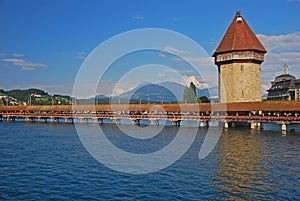 Wasserturm, water tower of long Kapellbrucke, Chapel Bridge is a covered wooden footbridge over river Reuss, Lucerne, Switzerland