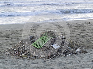 Waste on the beach: lots of  plastic causing sea pollution