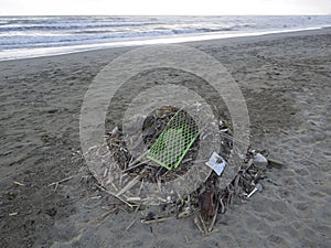 Waste on the beach: lots of  plastic causing sea pollution