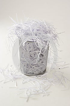 Waste bin full of shredding photo