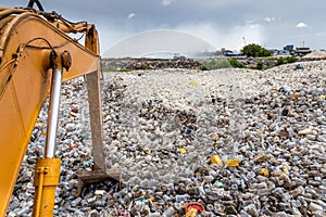 Waste dumping site with plastic waste photo