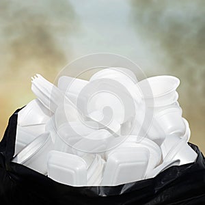 Waste Garbage foam food tray white many pile on the plastic black bag dirty on sky cloud air atmosphere pollution background