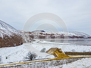 A waste heap or waste heap is a dump, an artificial embankment made of waste rock extracted during underground mining of mineral