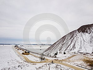 A waste heap or waste heap is a dump, an artificial embankment made of waste rock extracted during underground mining of mineral