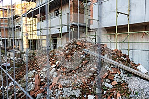 Waste material of a construction site and scaffolding