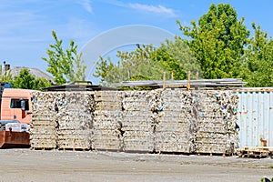 Waste paper stands on pallets at the factory. Waste paper recycling.