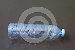 Waste plastic bottles float on the water surface, water pollution with garbage plastic, waste bottles plastic