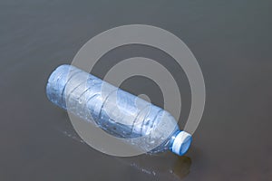 waste plastic bottles float on the water surface  water pollution with garbage plastic  waste bottles plastic