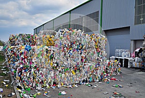 Waste plastics bottles at collection yard photo