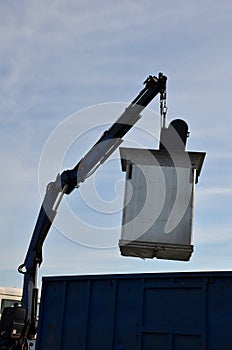 Waste recycling in separated waste containers. the bottom lid opens when the crane is pulled over the body of the truck, the raw m