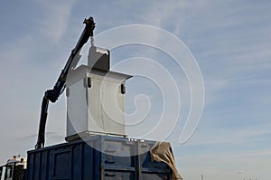 Waste recycling in separated waste containers. the bottom lid opens when the crane is pulled over the body of the truck, the raw m