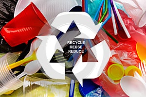 Waste reuse. Various plastic garbage and recycling emblem, top view. Collage