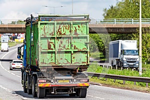 Waste tipper lorry truck on uk motorway in fast motion