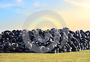 Waste tires and tyres at landfill for recycling. Regenerated tire rubber produced. Reuse of the waste rubber tyres. Pile of old