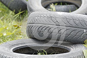 Waste Tyres Dumped in Grassland.