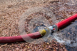 Waste water from pipe leaking. leaking fire pipeline joints. A ruptured hose. plumbing broken joints pipe in the hole with water