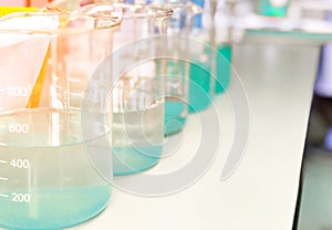 Waste water sample in beakers coagulation and flocculation method with Copper Sulfate and using Jar test for forming precipitation