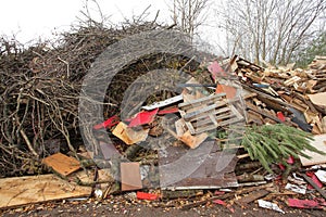 waste wood waste pallets firewood wood chips plywood for processing into chips stacked in a pile