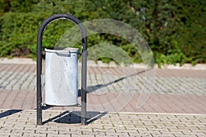 Wastebasket on a footpath at the port of Swinoujscie