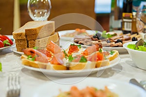 Wasted food on festive table after dinner party