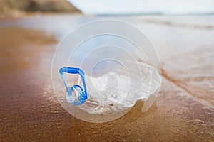 Wasted plastic bottle on beach photo