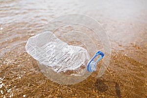 Wasted plastic bottle on beach