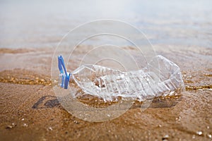 Wasted plastic bottle on beach