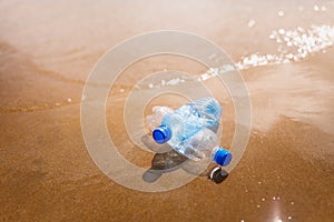 Wasted plastic bottles on beach